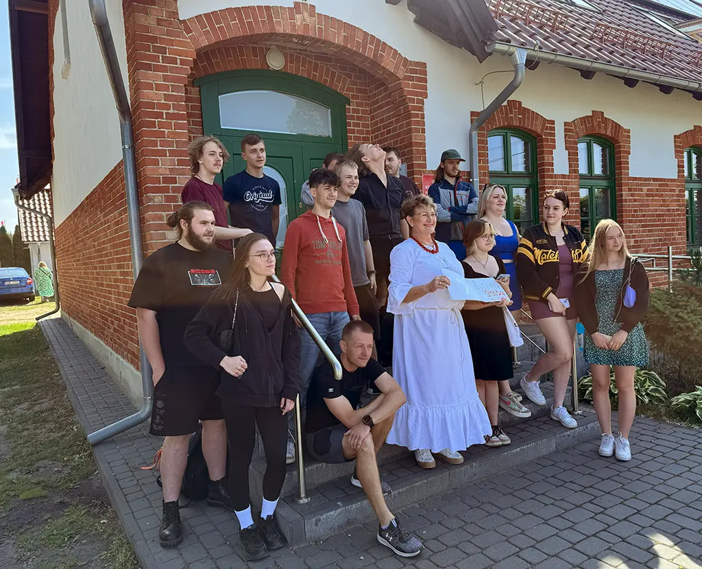 students in front of the building